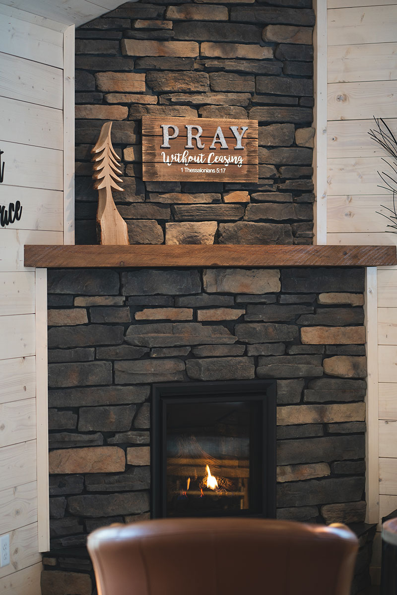 Embrace Prayer Cabin fireplace